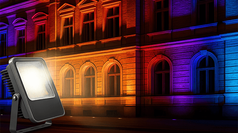 A high-quality LED floodlight illuminating a colorful building facade at night