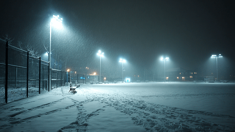 LED floodlights covered in snow but still brightly lit