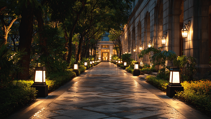 A well-lit hotel walkway at dusk, creating a safe and inviting path for guests