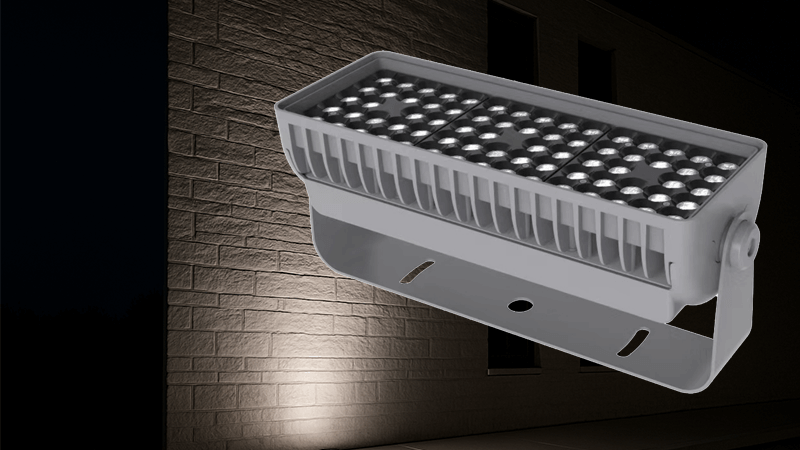 An LED floodlight illuminating a building facade, showing its bright and clean light.