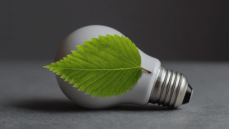 Eco-friendly LED lightbulb with a green leaf