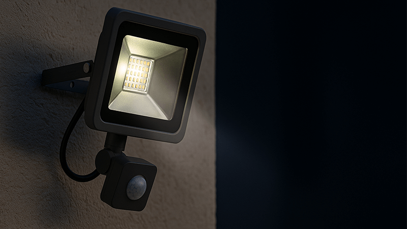 alt with keywords: A motion sensor attached to an outdoor LED floodlight