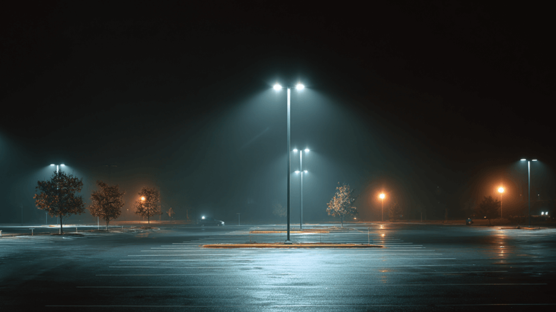 LED Parking Lot Illumination A well-lit parking lot at night using LED floodlights