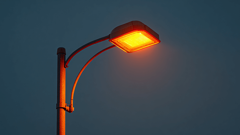 High-Pressure Sodium Parking Lot Light A classic orange-glowing HPS street light