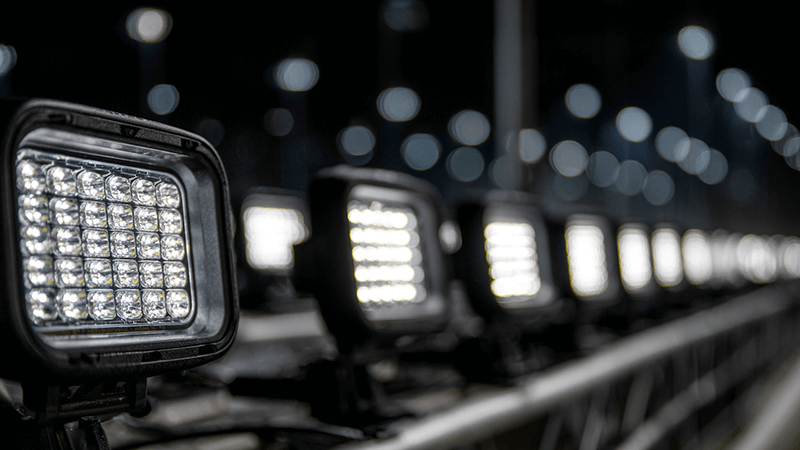 A collection of modern, high-quality LED floodlights lined up