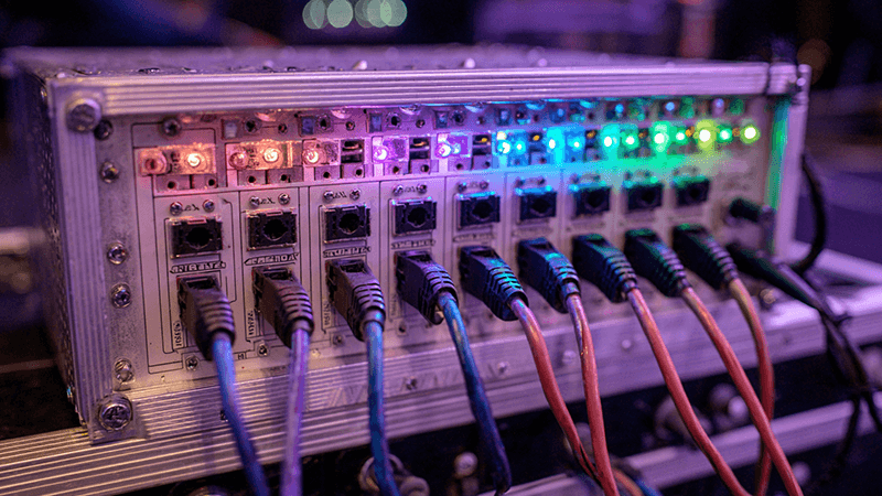 Multi-Universe DMX Controller A multi-universe DMX controller with several output ports, connected to different zones of a large lighting project.