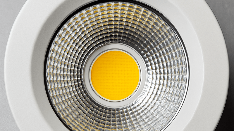 A close-up of a COB LED chip inside a downlight.