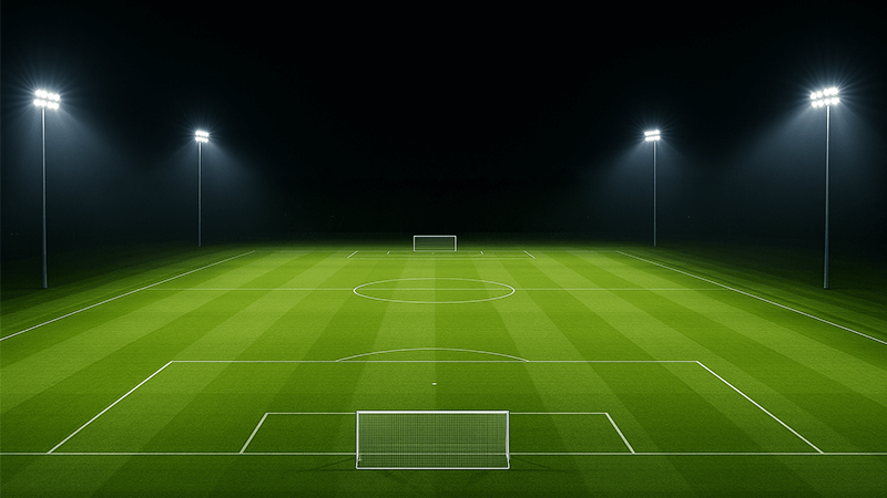 A football pitch lit with bright, uniform LED lights