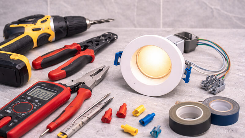 DIY tools next to an LED downlight fixture