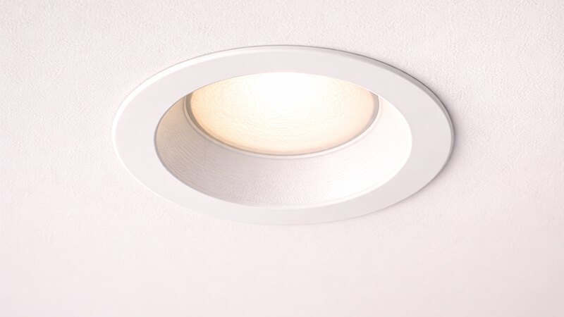 A close-up of a high-quality recessed downlight showing its clean design.